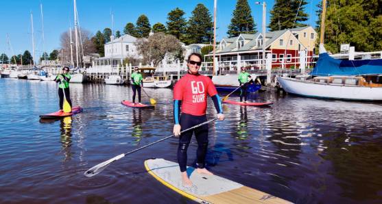 Stand-up paddleboarders on the Moyne River in Port Fairy