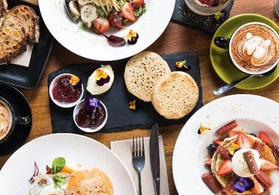 Brunch dishes and coffee on a café table