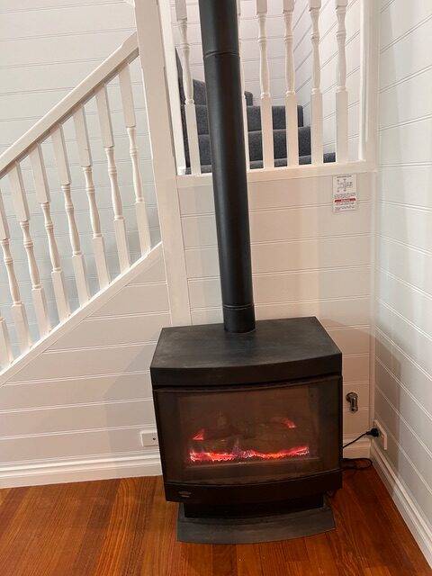 Gas log fire beside the staircase in the Sails villa